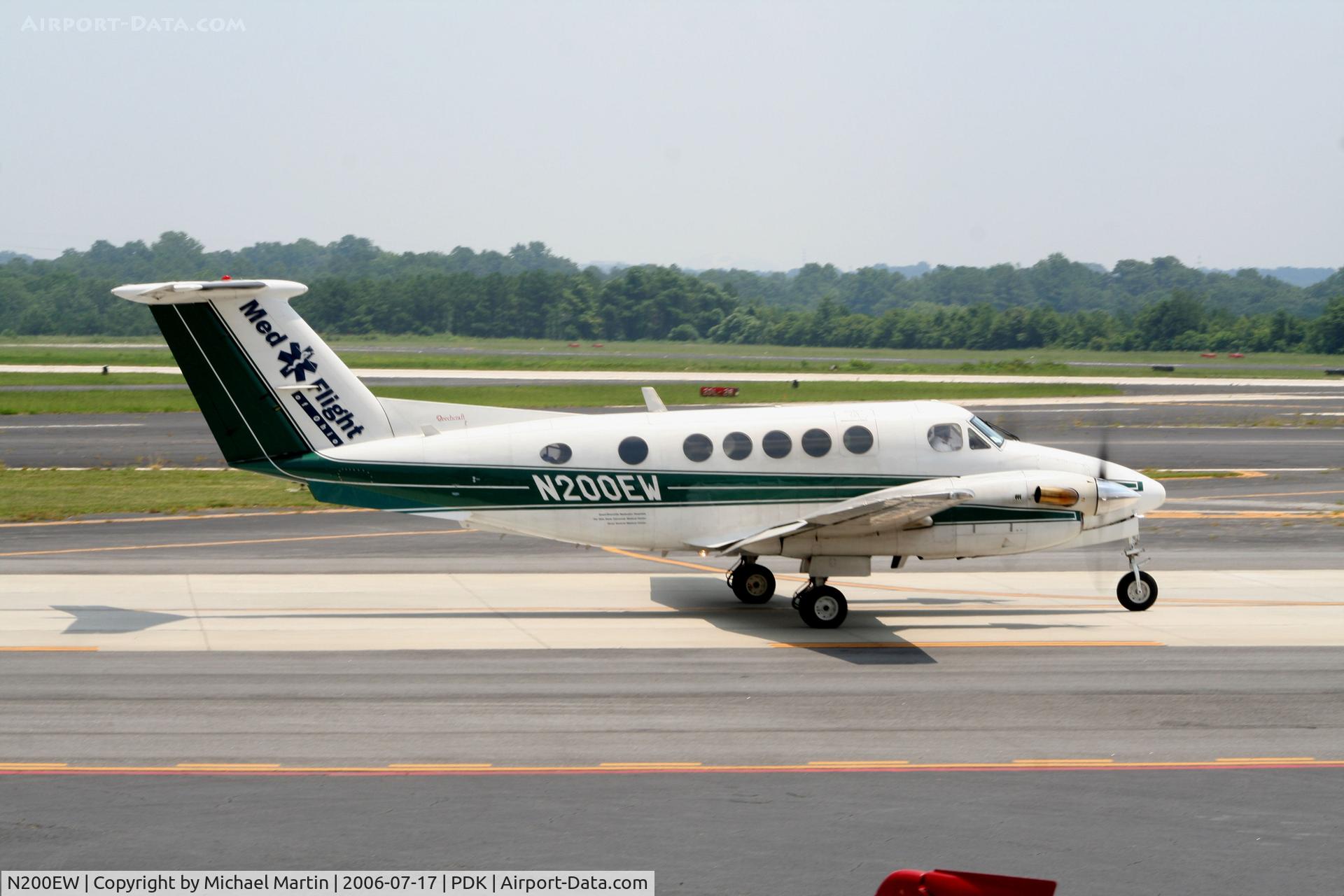 N200EW, 1983 Beechcraft B200 King Air C/N BB-1163, Taxing past Mercury Air Service