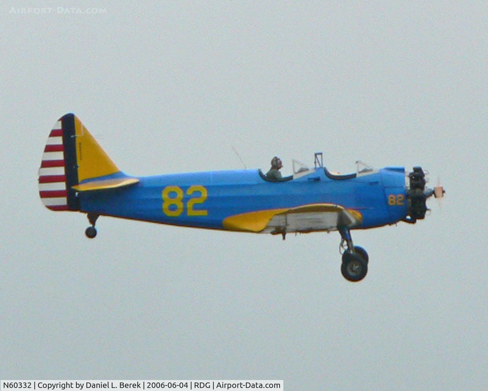 N60332, 1946 Fairchild (St. Louis) PT-23A Cornell (M-62C) C/N 225SL, Bright blue and yellow Cornell trainer contrasts against a brooding, overcast sky.