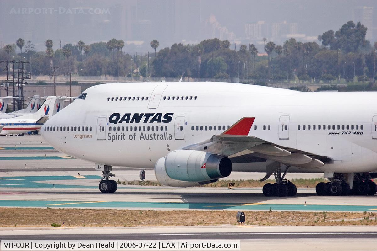 VH-OJR, 1992 Boeing 747-438 C/N 25547, Qantas VH-OJR (FLT QFA25) holding short of RWY 25R on Taxiway Tango after arriving on RWY 25L from Auckland, New Zealand (NZAA).