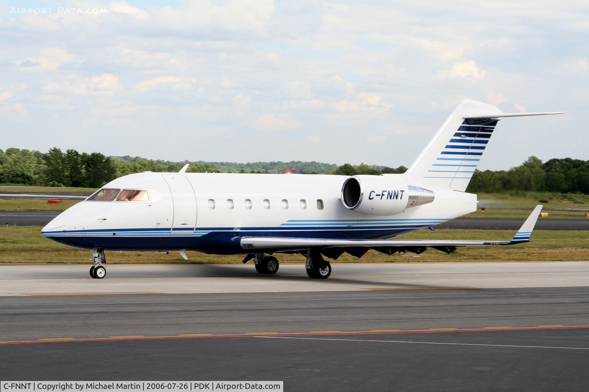 C-FNNT, 1996 Canadair Challenger 604 (CL-600-2B16) C/N 5317, Taxing past Mercury Air Service
