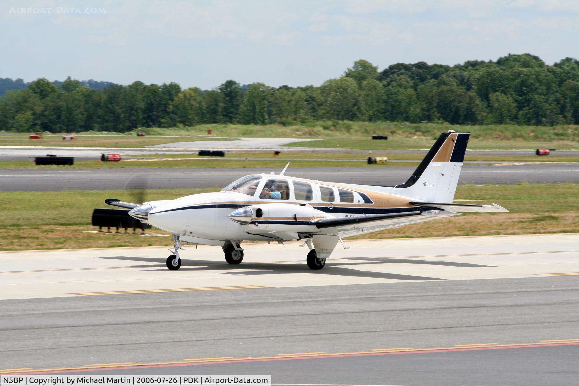 N5BP, 1980 Beech 58P Baron C/N TJ-315, Taxing past Mercury Air Service