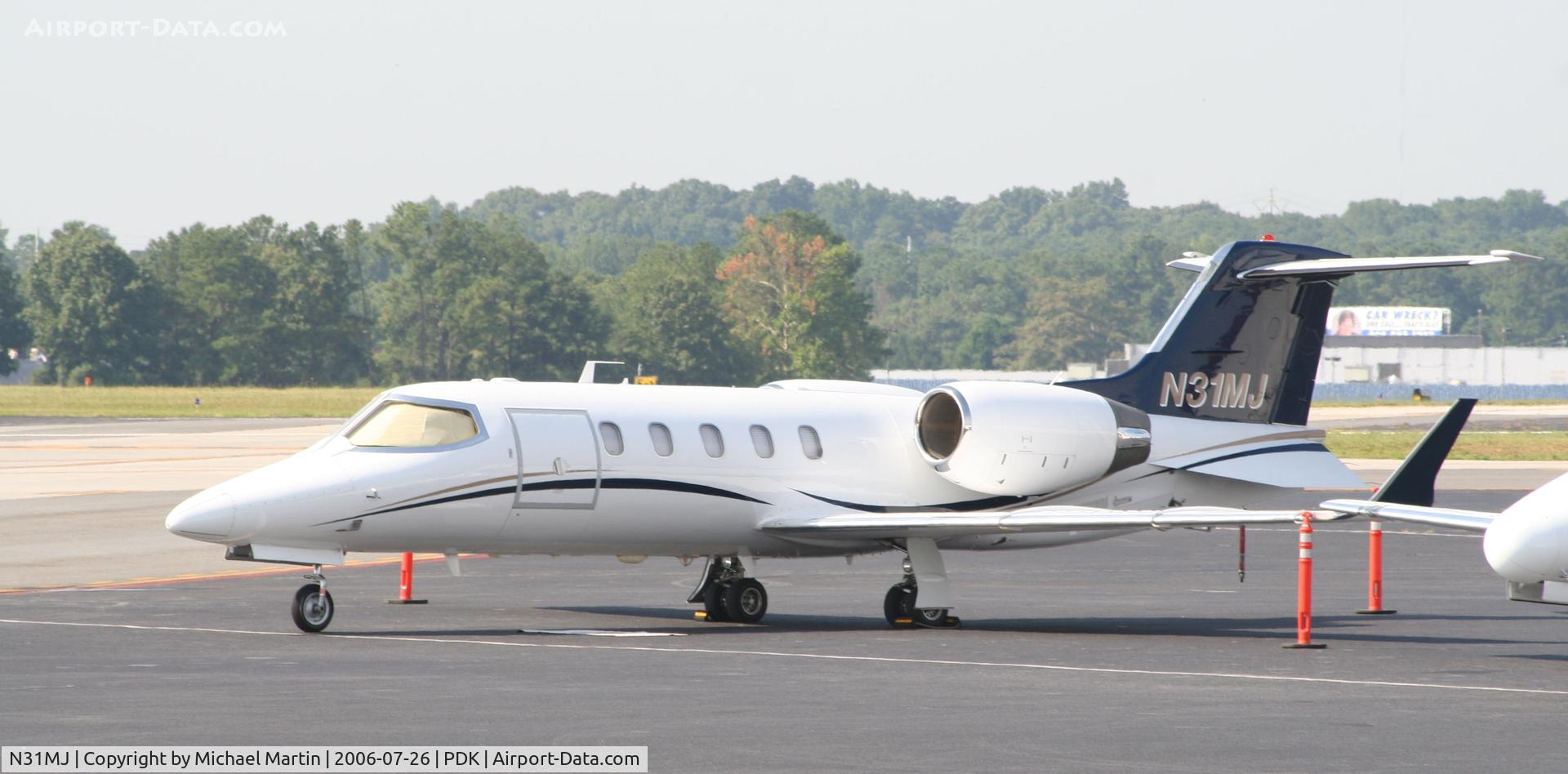 N31MJ, 1999 Learjet 31A C/N 185, Tied down @ Mercury Air Center