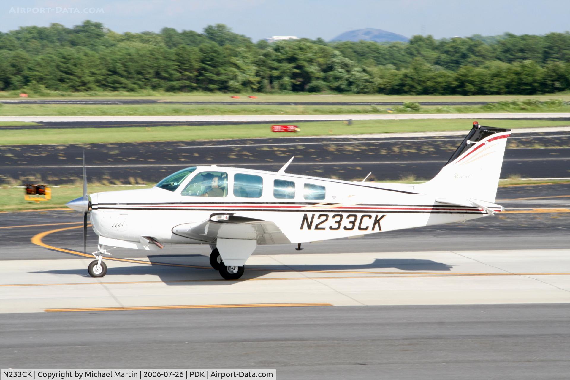 N233CK, 1977 Beech A36 Bonanza 36 C/N E-1014, Taxing to Runway 20R