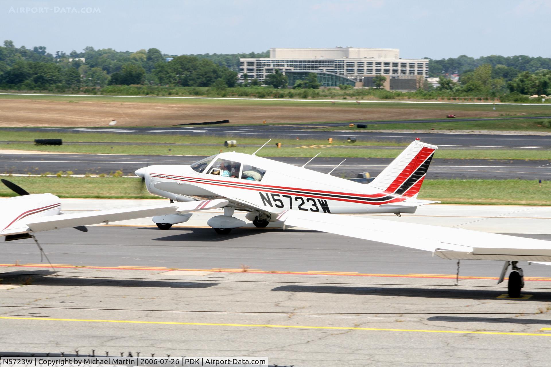 N5723W, 1963 Piper PA-28-160 Cherokee C/N 28-1281, Taxing past tied down aircraft