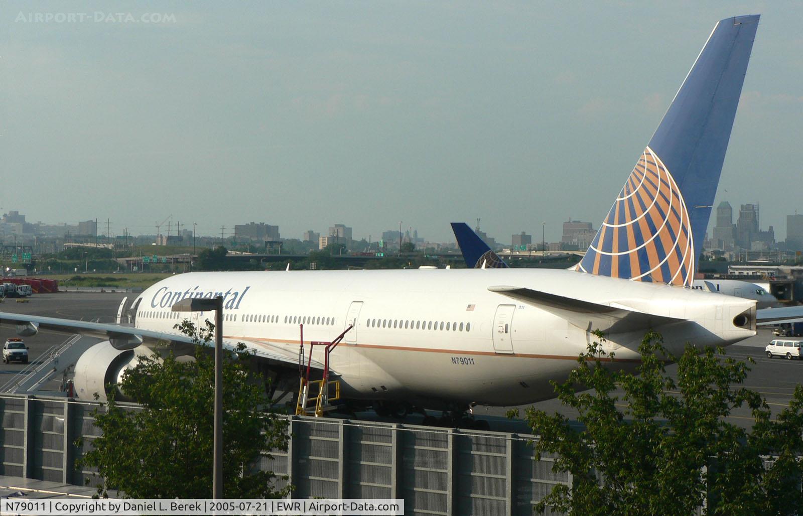 N79011, 1999 Boeing 777-224 C/N 29859, Getting decent views from the EWR monorail can be tricky, such as this CO 772 sitting it out on a hazy summer afternoon.