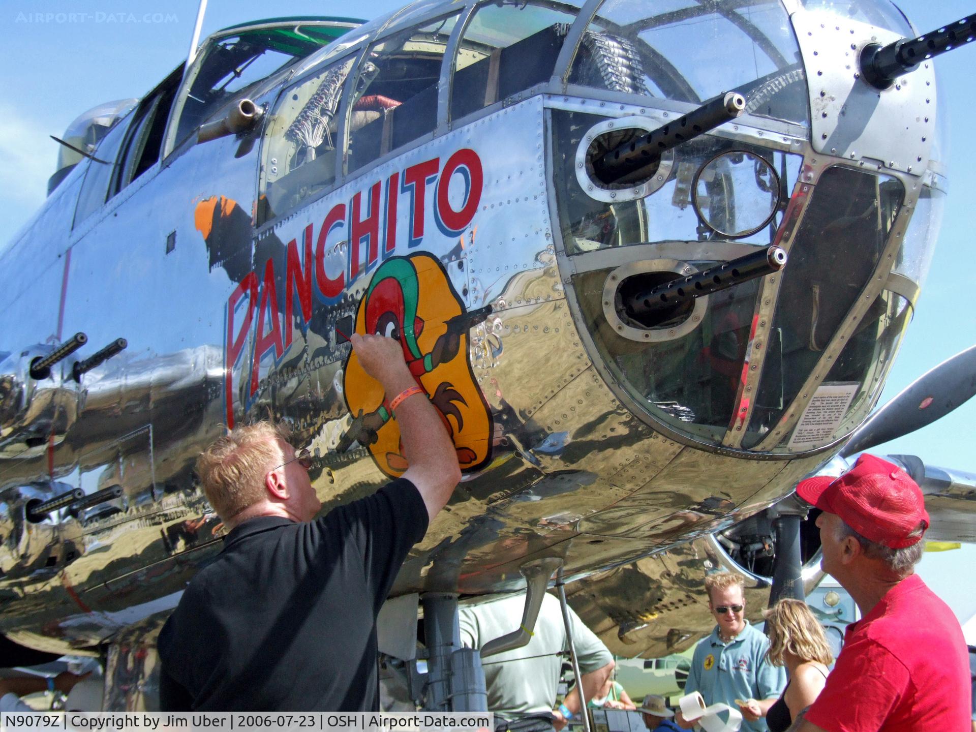 N9079Z, 1944 North American TB-25N Mitchell C/N 108-34009, Crewmember touches-up the noseart before the show