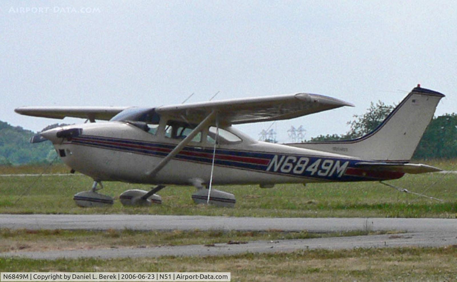N6849M, 1975 Cessna 182P Skylane C/N 18263860, This 1975 Skylane is keeping an older Cessna 150 company on a lazy summer afternoon.