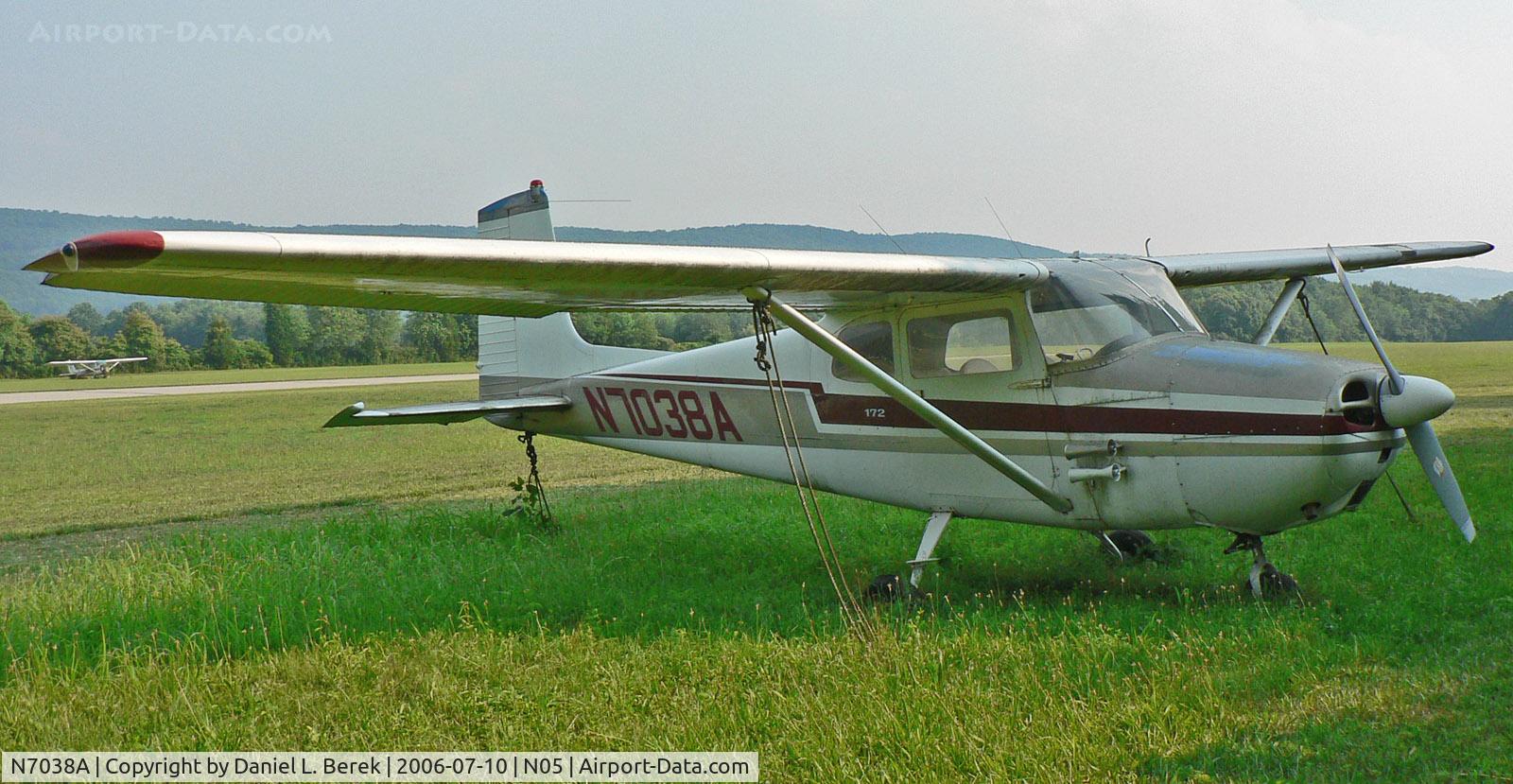 N7038A, 1956 Cessna 172 C/N 29138, Paint faded and its wheels sinking into the ground, this 1956 Skyhawk does not appear to have flown for quite a while. The Cessna 150 in the background is certainly no better off!