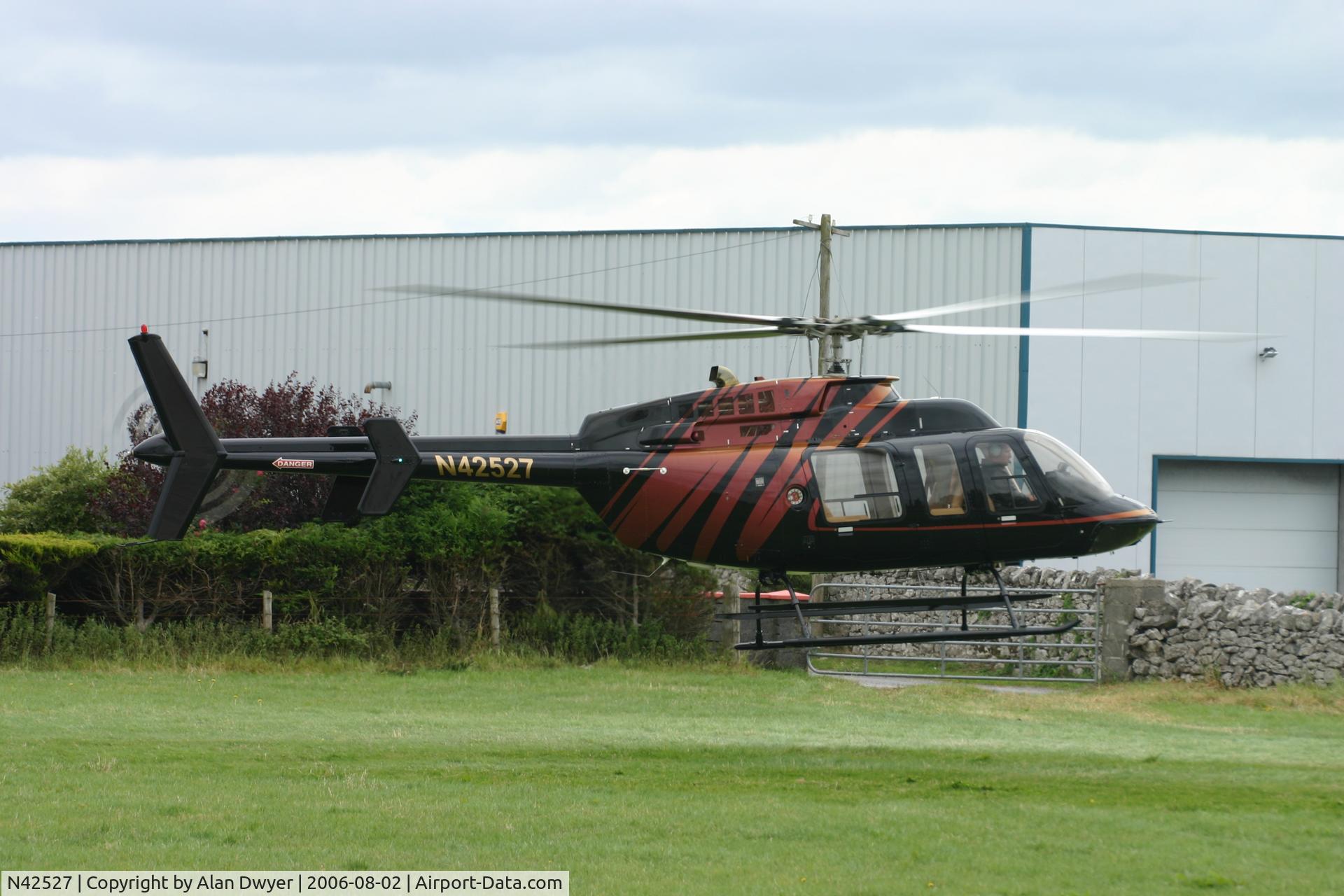 N42527, 1999 Bell 407 C/N 53384, Just about to depart to collect passengers