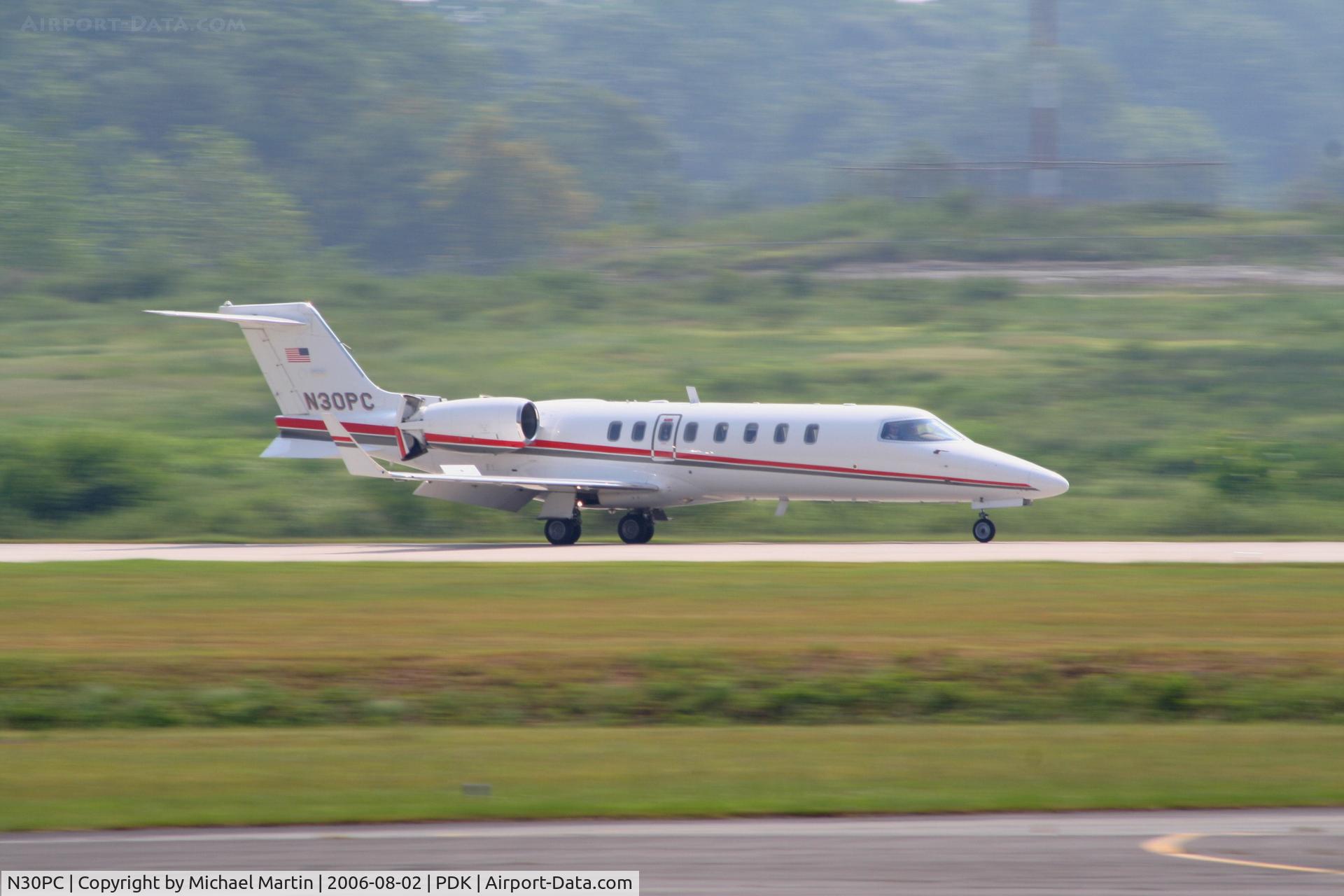 N30PC, 2003 Learjet 45 C/N 235, Southern Companies returning home to PDK