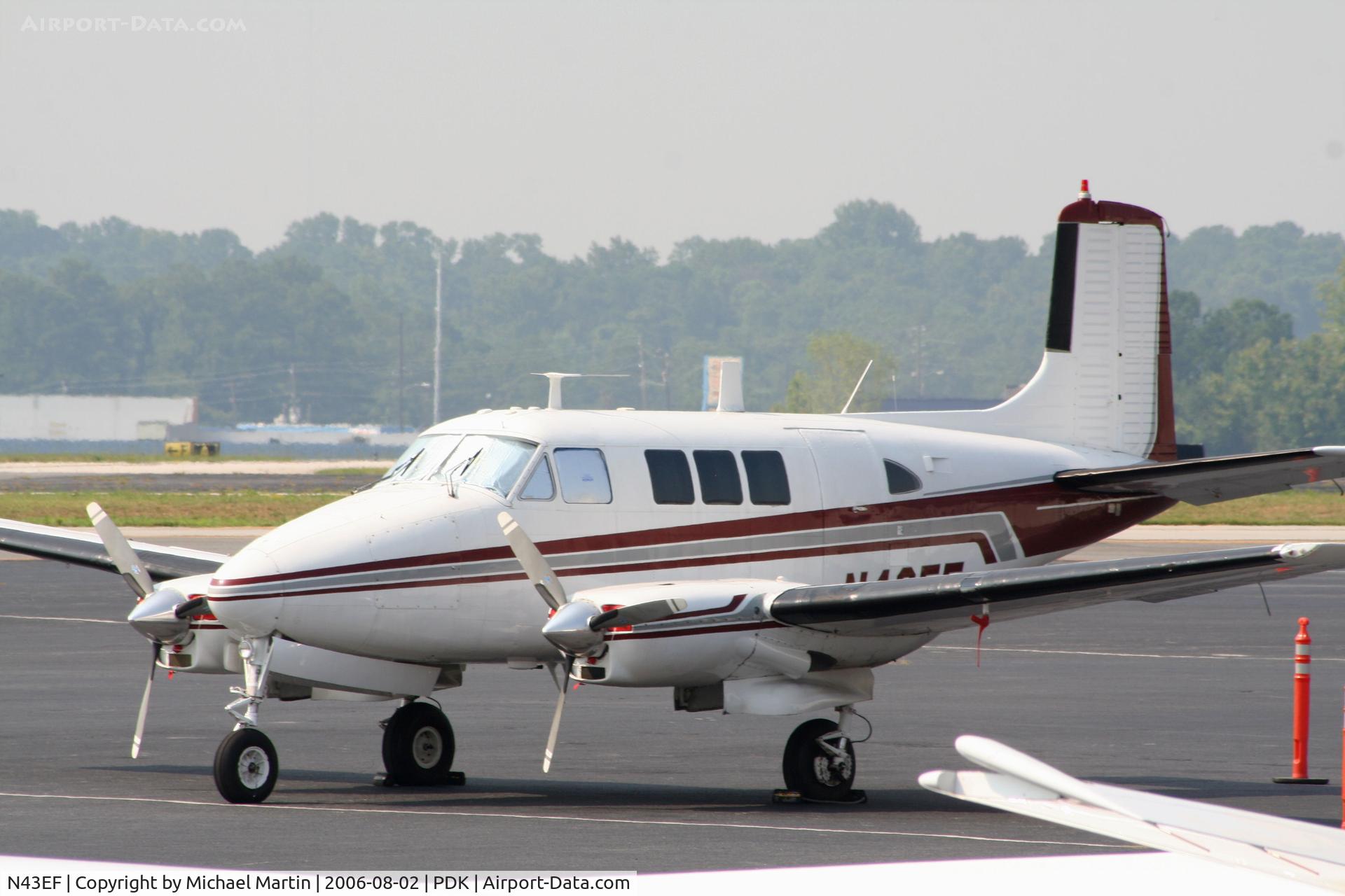 N43EF, Beech 65 (LF-23F) C/N LF-48, Tied Down @ Mercury Air Center with other A/C