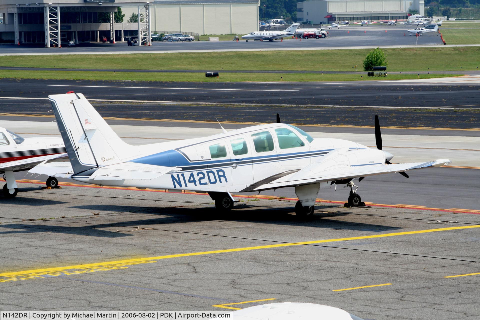 N142DR, 1985 Beech 58 Baron C/N TH-1458, Tied down @ Epps with other aircraft