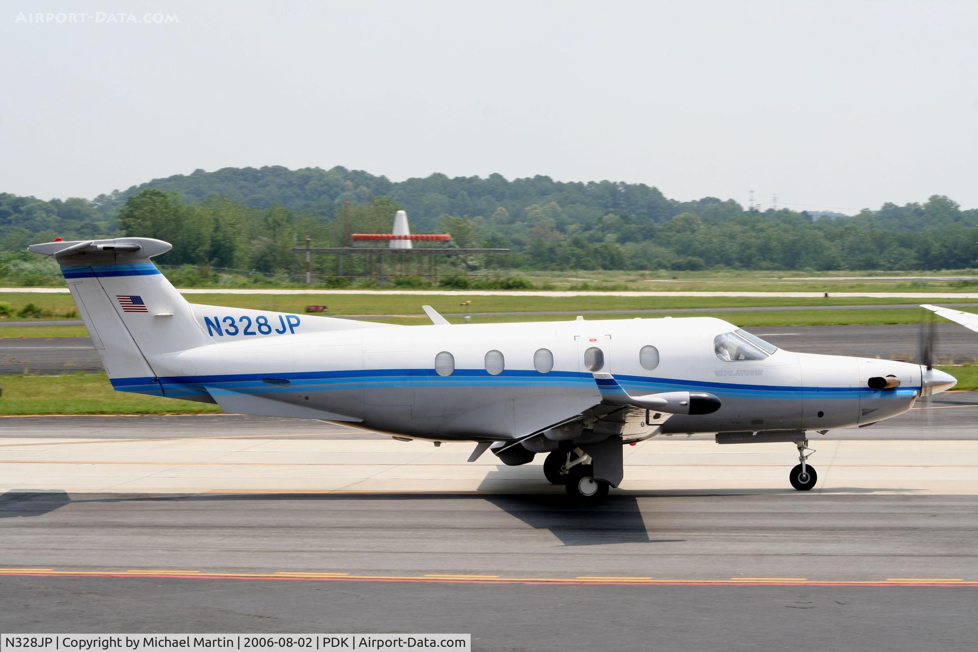 N328JP, 2000 Pilatus PC-12/45 C/N 328, Taxing past Mercury Air Service