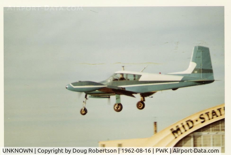 UNKNOWN, Miscellaneous Various C/N unknown, 1955 Cessna 310, two Continental O-470-M 240 Hp, 'tuna' tanks, on close final for landing at PWK, called Palwaukee Airport at the time in Illinois north-westerly of Chicago.