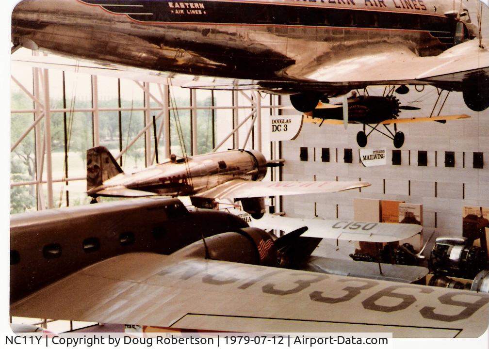 NC11Y, 1930 Northrop 4A Alpha C/N 3, 1930 Northrop ALPHA as NC11Y, past the Boeing 247 D and below the Douglas Eastern Airlines DC-3, note the streamlined spatted pants enclosing fixed landing gear, at National Air & Space Museum