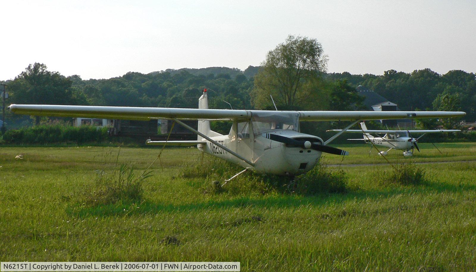 N6215T, 1964 Cessna 150E C/N 15060915, A 1964-vintage Cessna two-seater and a more recent sistership enjoy an summer evening at Sussex.