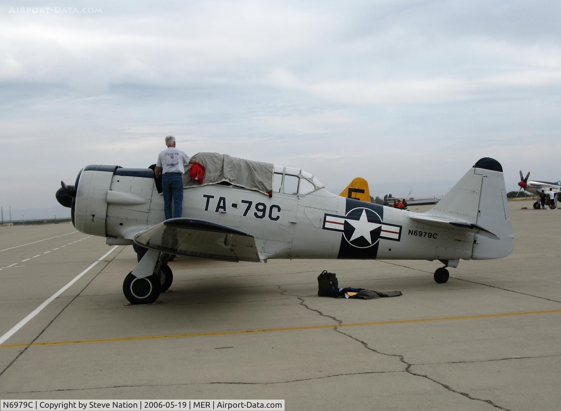 N6979C, North American AT-6D Texan C/N 42-85408, Putting the cover on AT-6D 42-85408 (ain't no sun!) @ Castle AFB, CA