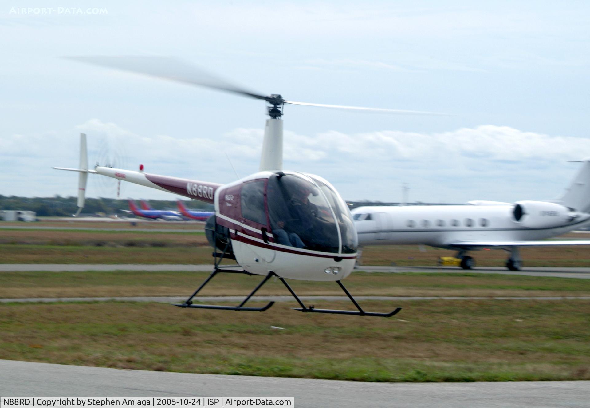N88RD, 1992 Robinson R22 BETA C/N 2214, 88RD hover-taxiing from the Whiskey Pad with 745RS behind her.