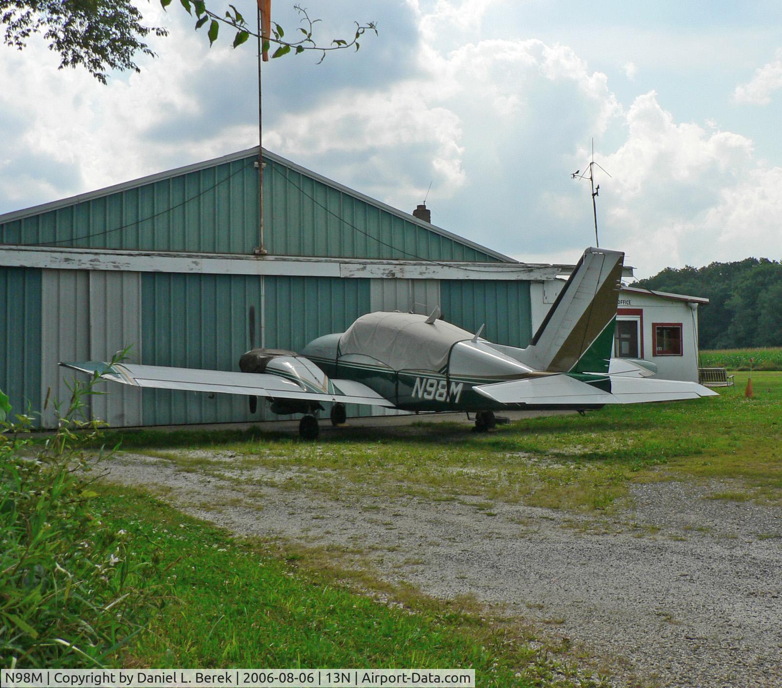 N98M, Piper PA-23-250 C/N 27-7554043, Piper Aztec rests in front of Trinca Airport corporate headquarters.
