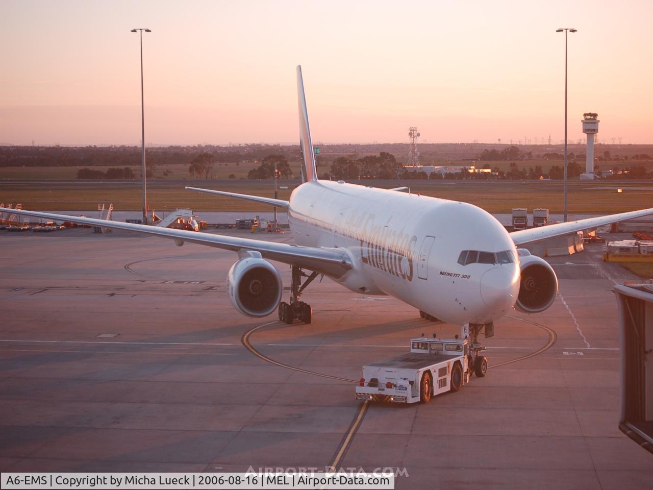 A6-EMS, 2002 Boeing 777-31H C/N 29067, Being towed to the gate in the evening sun