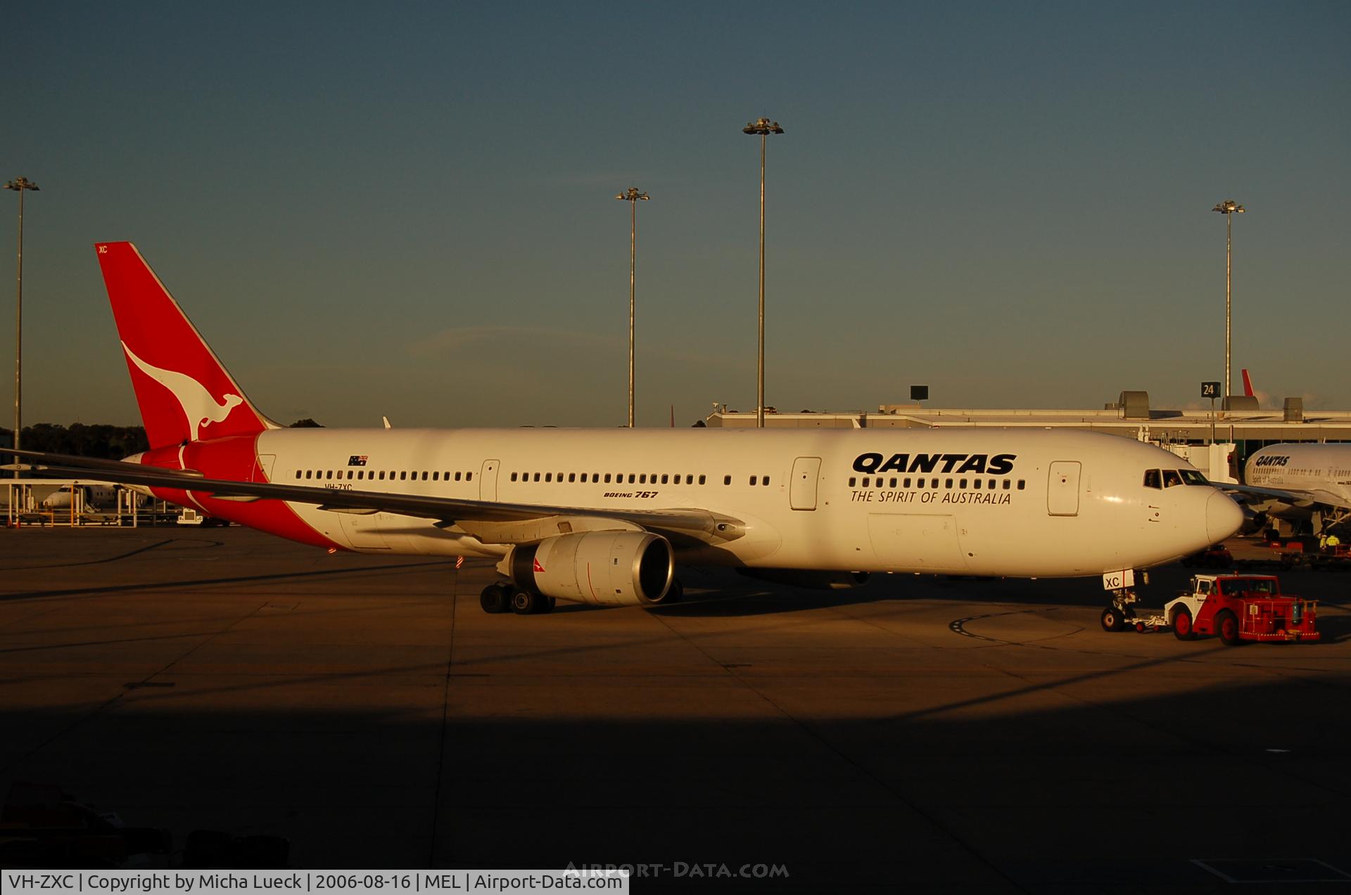 VH-ZXC, 1990 Boeing 767-336 C/N 24339, Push-back in Melbourne's evening sun