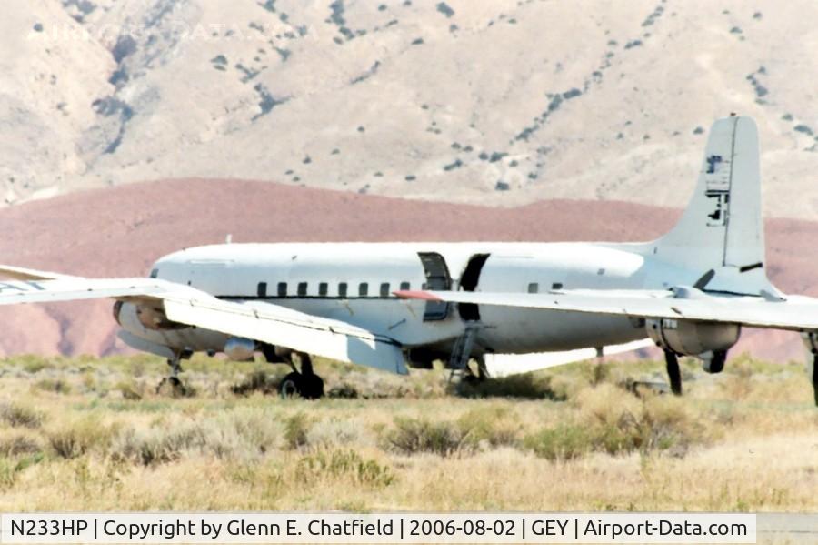 N233HP, 1955 Douglas C-118A Liftmaster (DC-6A) C/N 44661, C-118 53-3290.  In storage, shot with 600mm lens.