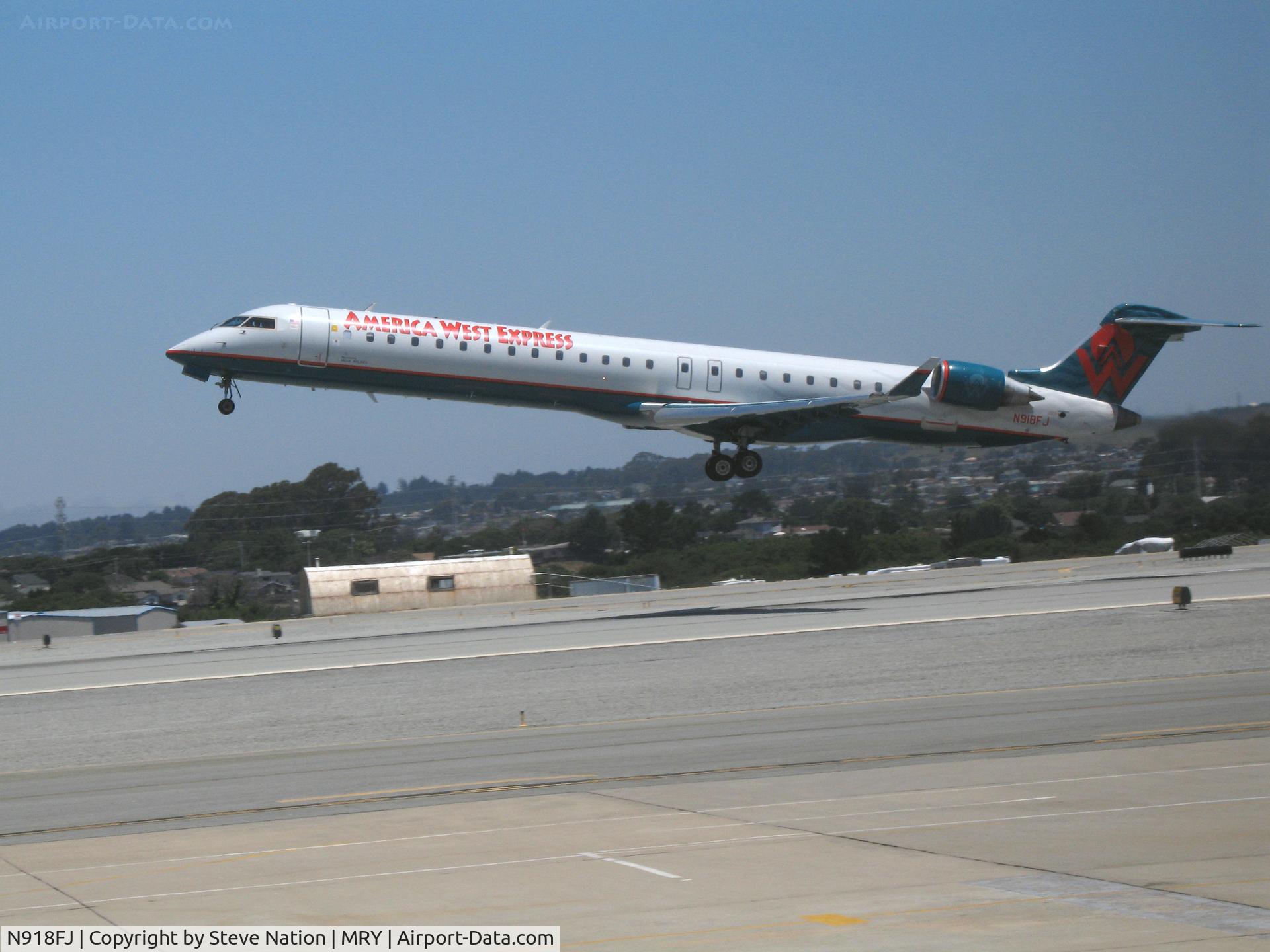 N918FJ, 2004 Bombardier CRJ-900ER (CL-600-2D24) C/N 15018, America West Express CL600-2D24 getting airborne @ Monterey-Peninsula Airport, CA