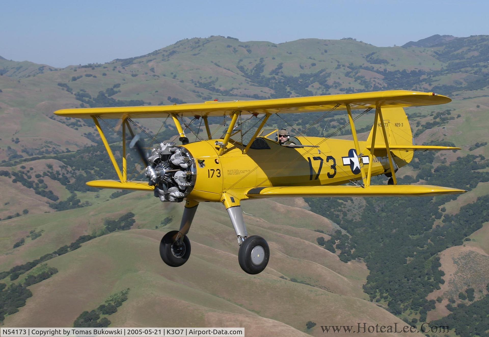 N54173, 1942 Boeing B75N1 C/N 75-6574, Stock Stearman N2S-3 flying wing above Hollister