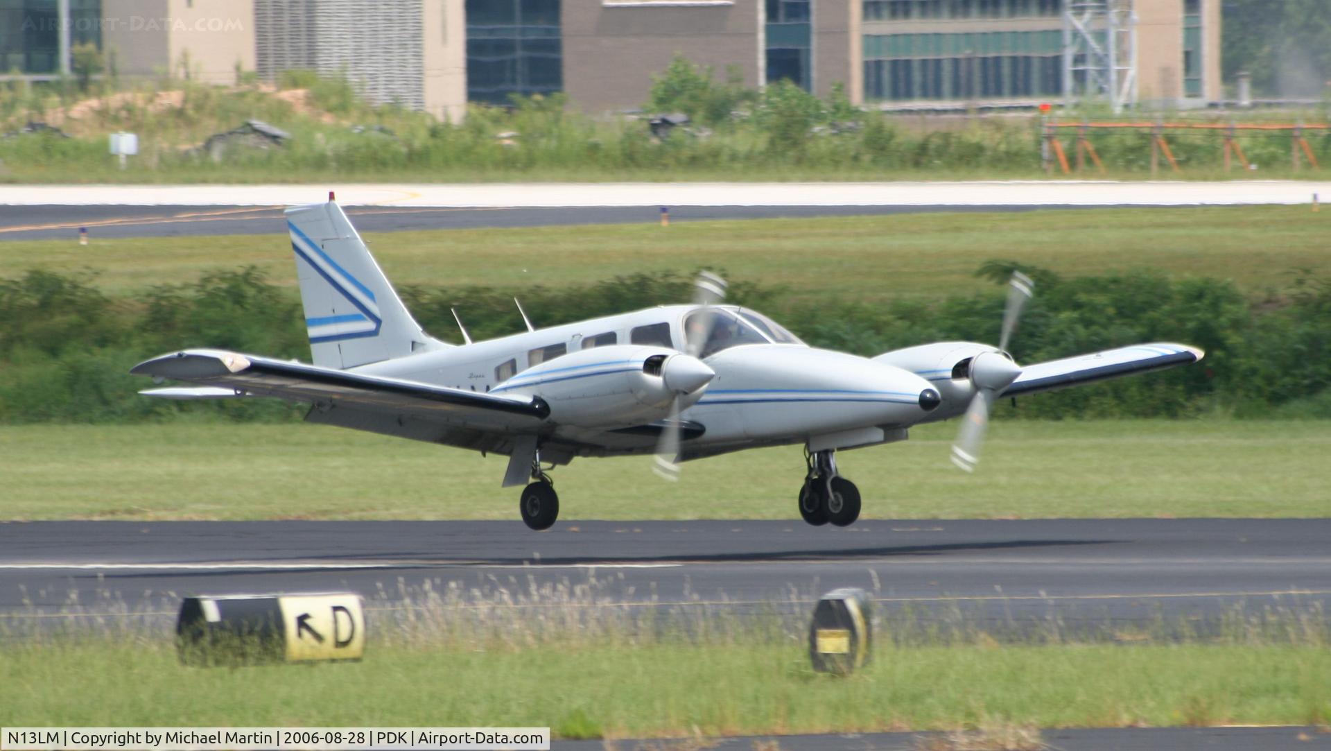 N13LM, 1977 Piper PA-34-200T C/N 34-7870075, Landing 20R just feet from the runway