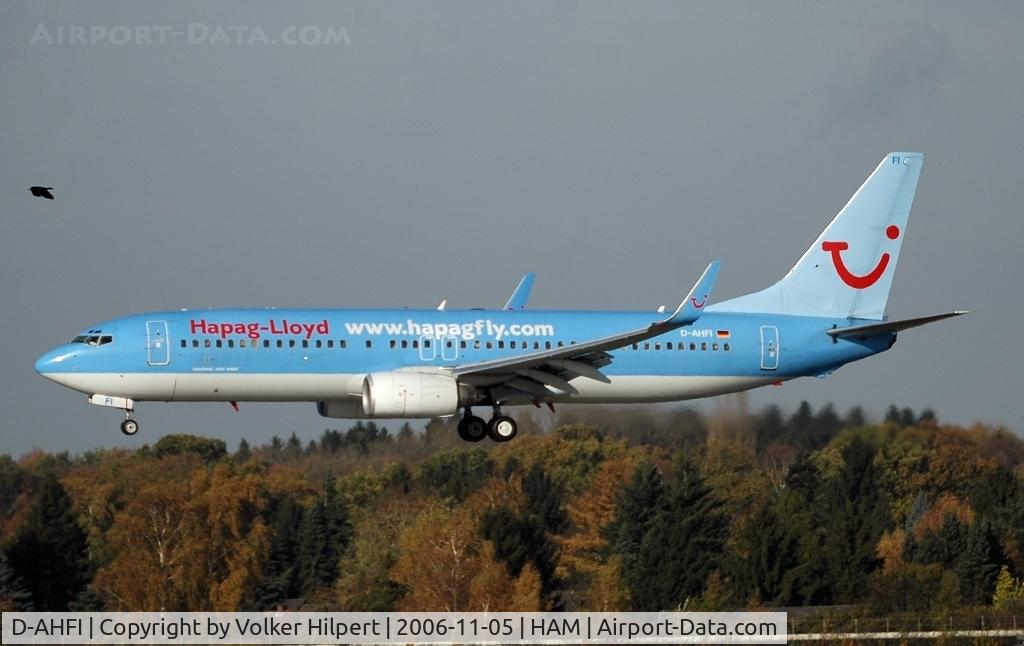 D-AHFI, 1999 Boeing 737-8K5 C/N 27984, accompanied by a raven