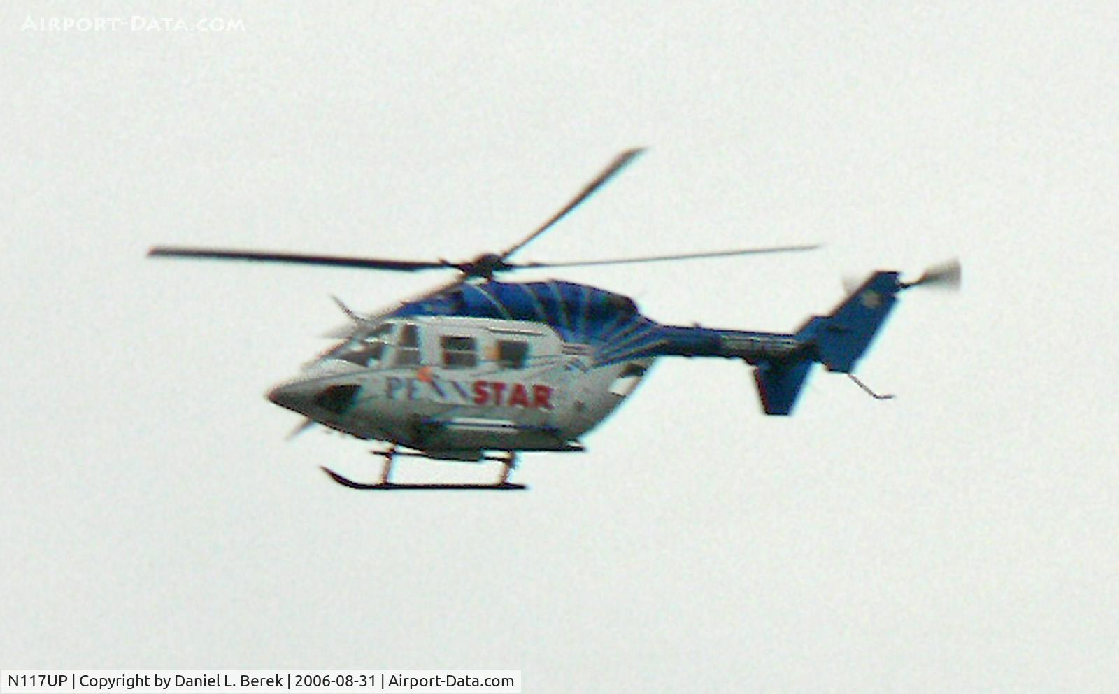 N117UP, 1994 Eurocopter-Kawasaki BK-117C-1 C/N 7508, Medivac helicopter cruises over Philadelphia's scenic waterfront.