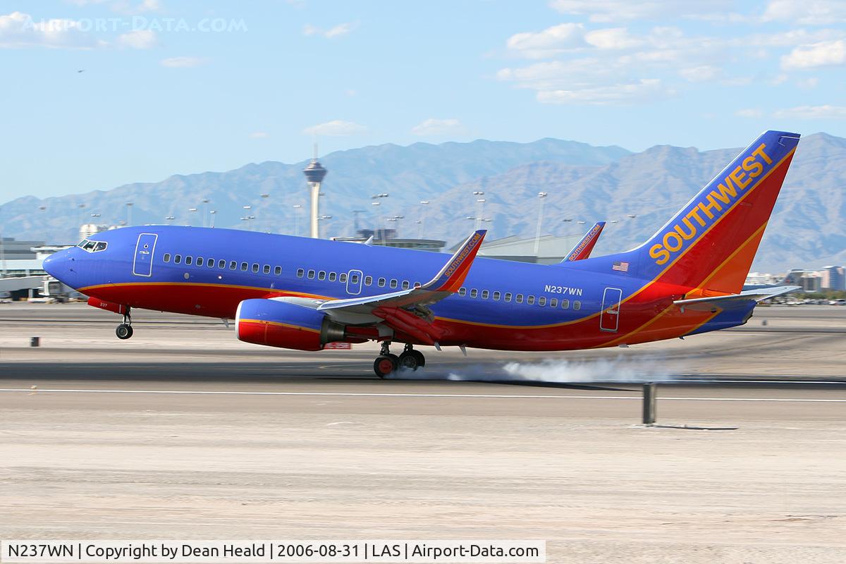 N237WN, 2006 Boeing 737-7H4 C/N 34632, Southwest Airlines N237WN (FLT SWA1813) from Reno Tahoe Int'l (KRNO) touching down on RWY 25L.