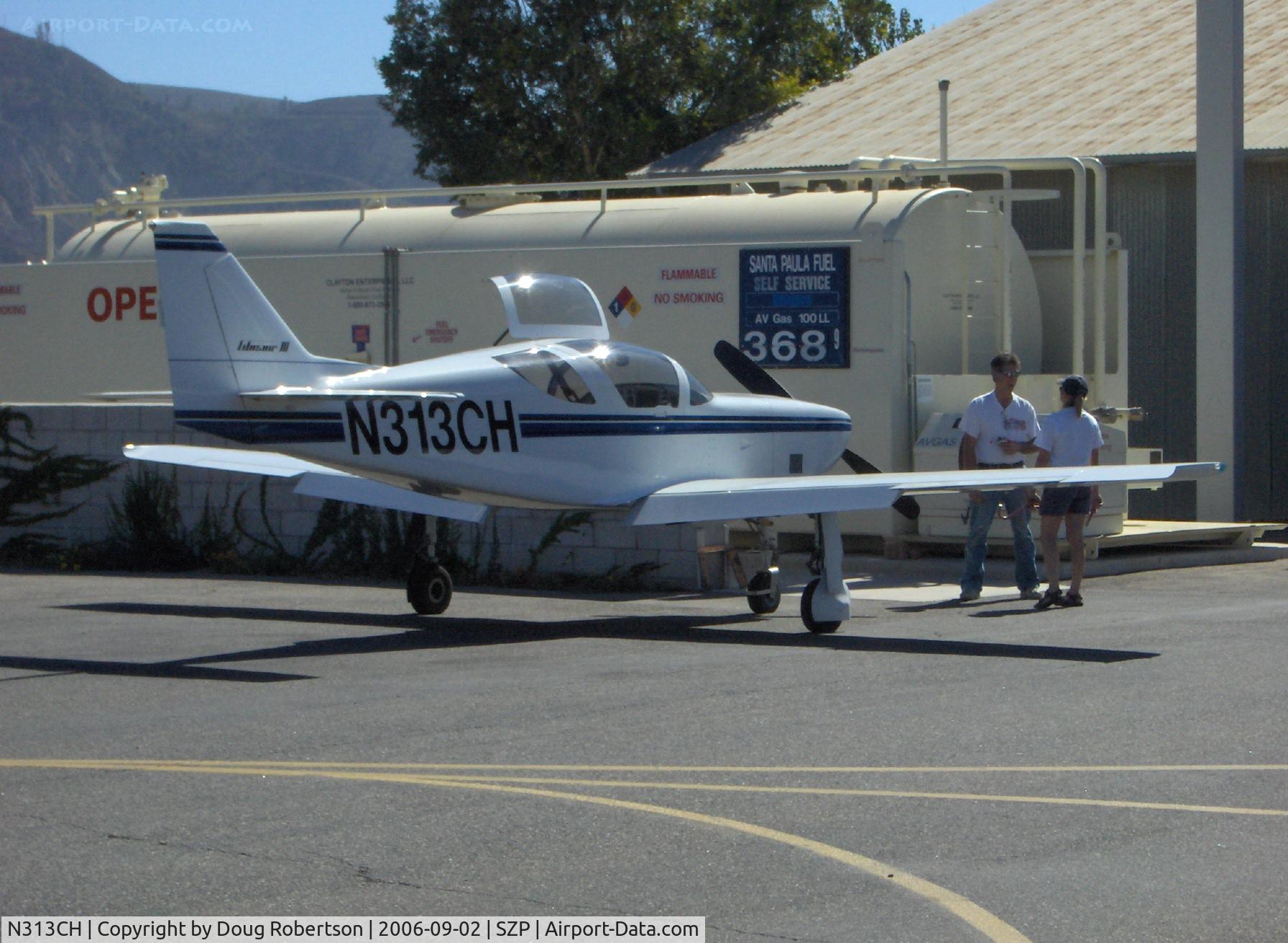 N313CH, 1991 Stoddard-Hamilton Glasair SH-3R C/N 3017, 1991 Hautamaki GLASAIR III SH-3R, Lycoming IO-540, refueling, pilot/owner Vicki Cruse President International Aerobatic Club talking with A&P, Vicki's 'Cruse Missile' Sport Class Reno racer
