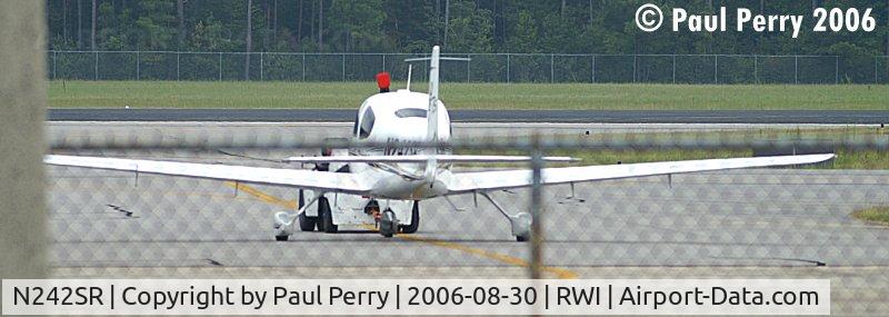 N242SR, 2006 Cirrus SR22 C/N 2002, Being towed from one end of the airport to the other