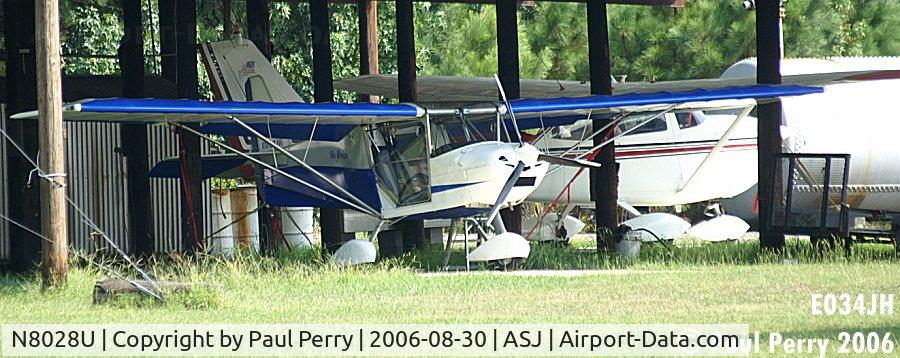 N8028U, 2005 Best Off Skyranger II C/N SKR0205572, Hangaerd homebuilt with big sis Cessna in the background
