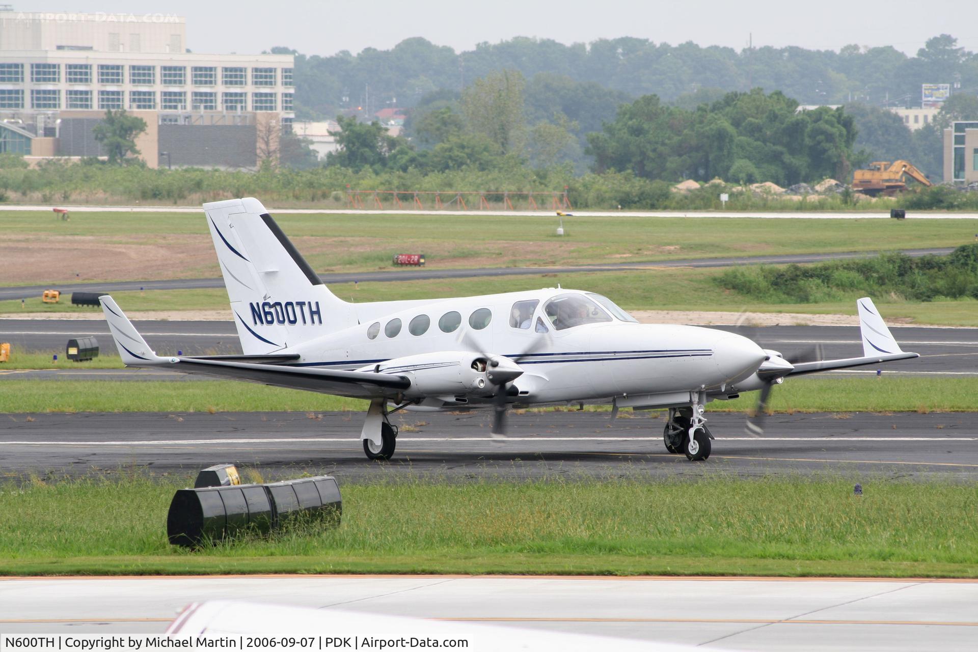 N600TH, 1981 Cessna 414A Chancellor C/N 414A0668, Taxing past Mercury Air Service