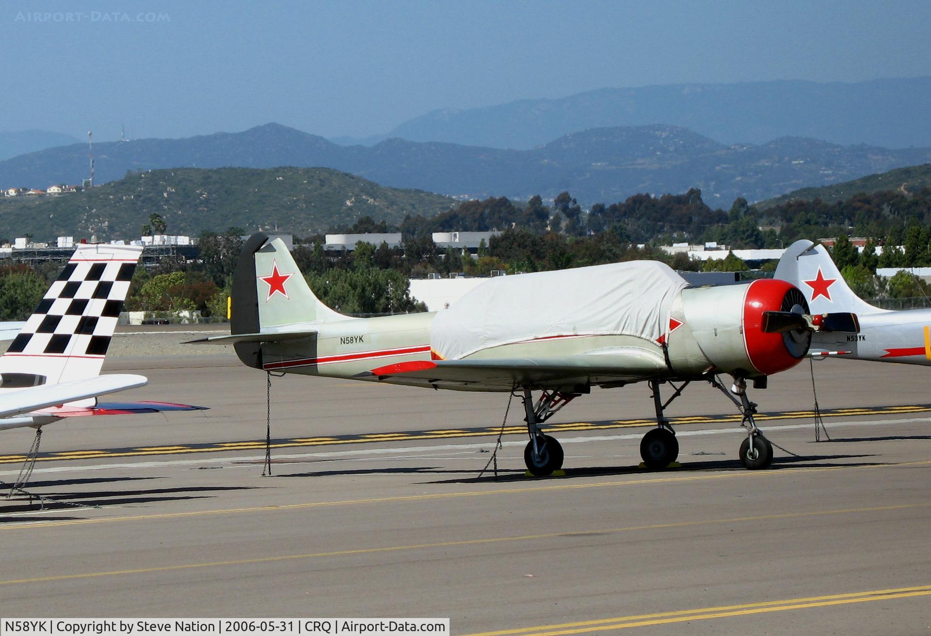 N58YK, 1986 Yakovlev Yak-52 C/N 866302, Witter Associates 1986 Yakovlev YAK-52 with canopy cover @ McClellan-Palomar Airport, CA