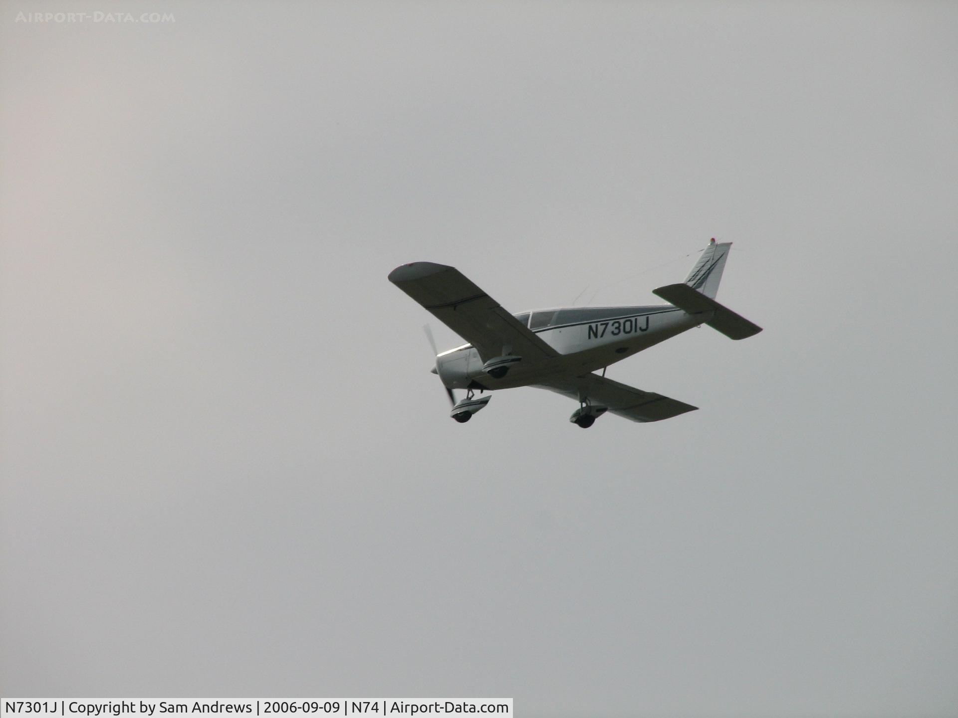 N7301J, 1968 Piper PA-28-140 C/N 28-24596, Over the tractor show.  Weather was a bit iffy.