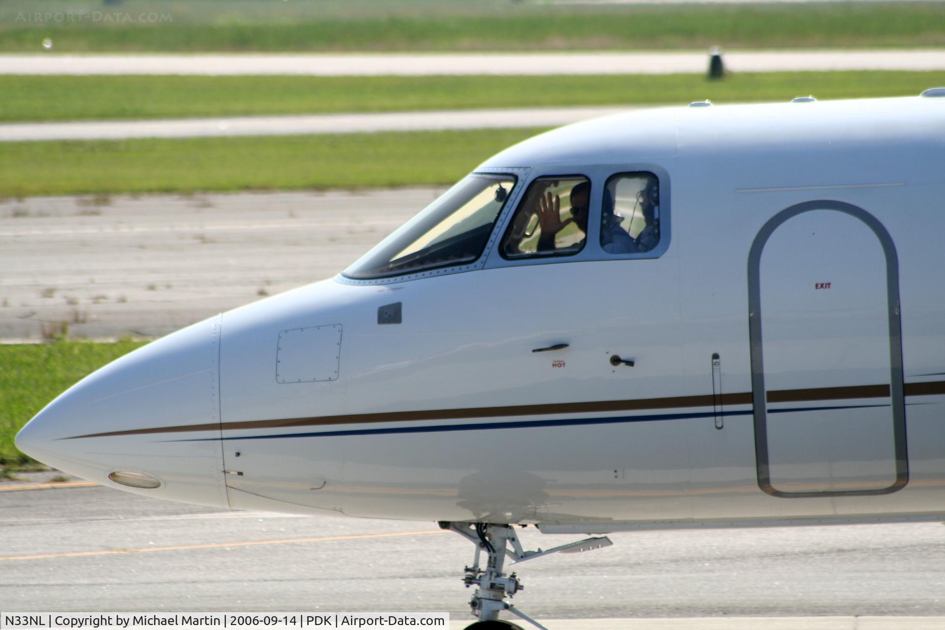N33NL, 2003 Raytheon Hawker 800XP C/N 258643, Nice pilot waving!