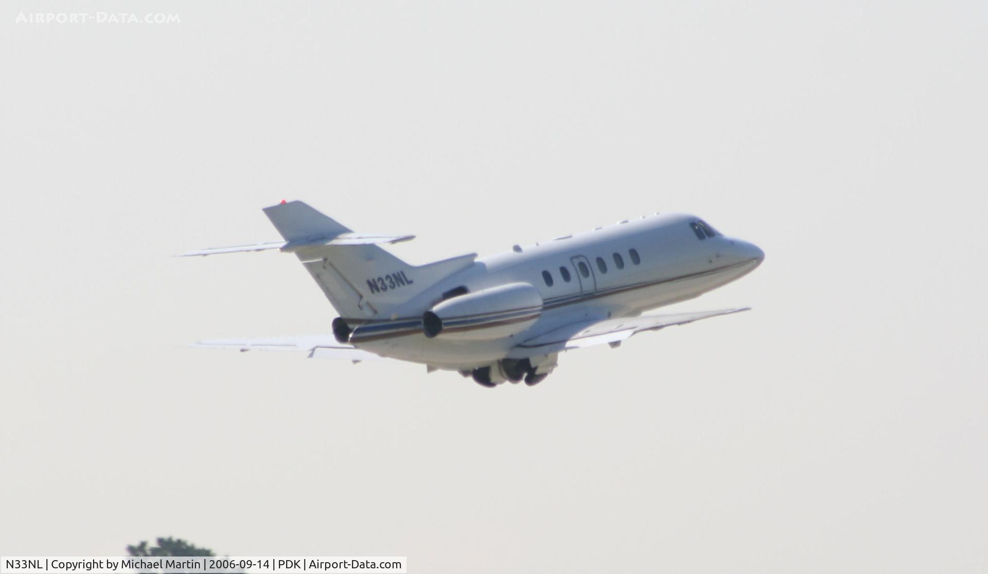 N33NL, 2003 Raytheon Hawker 800XP C/N 258643, Gear up after take off from 20L