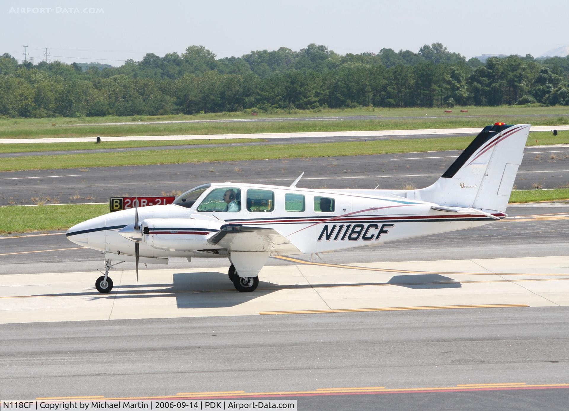 N118CF, 1978 Beech 58 Baron C/N TH-924, Taxing past Mercury Air Service