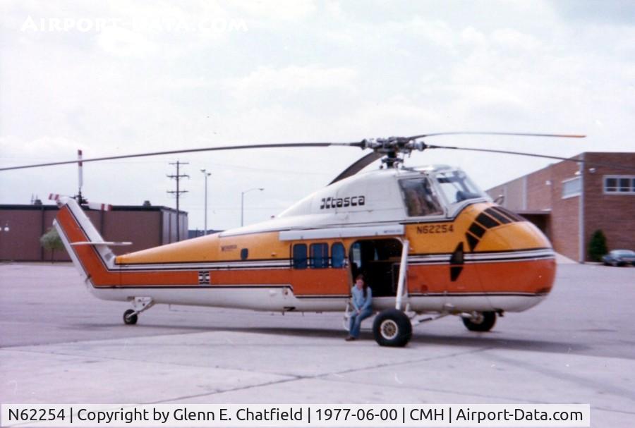 N62254, Sikorsky UH-34D Seahorse C/N 58-1193, ex USMC UH-34D BuNo. 148079. This was when it was a Winnebago Heli-Home model, with my wife sitting in the door.  We watched it fly and toured it.