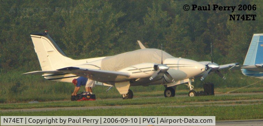 N74ET, 1964 Beech 95-B55 (T42A) Baron C/N TC-619, Baggage retrieval after getting the cover on