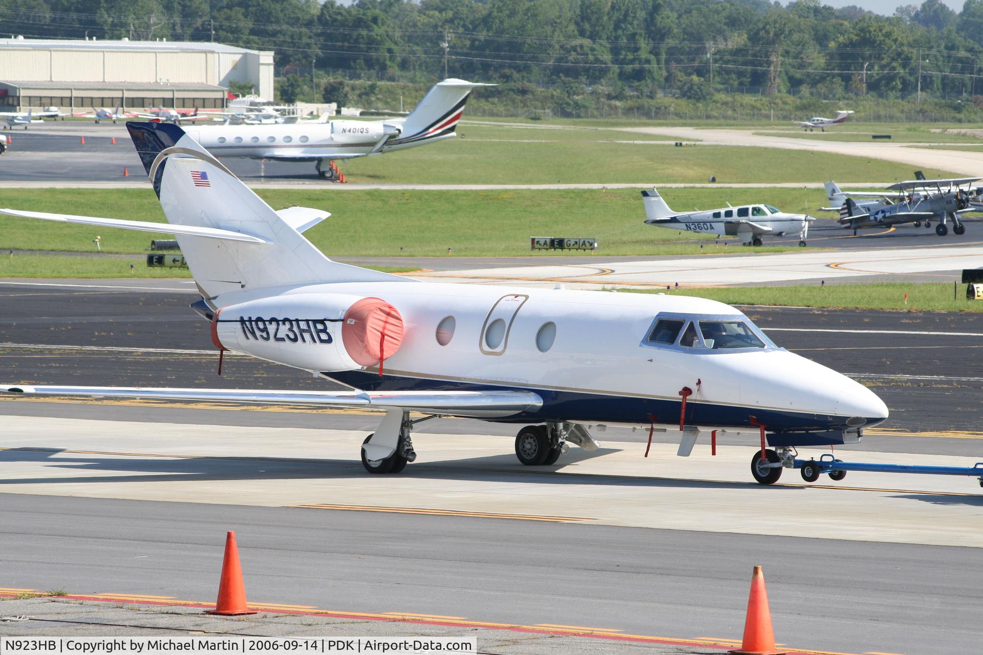 N923HB, 1977 Dassault Falcon 10 C/N 99, Being towed to parking at Mercury Air Center
