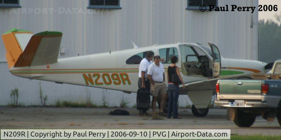 N209R, 1962 Beech P35 Bonanza C/N D-6990, Loading up, and with a pretty passenger