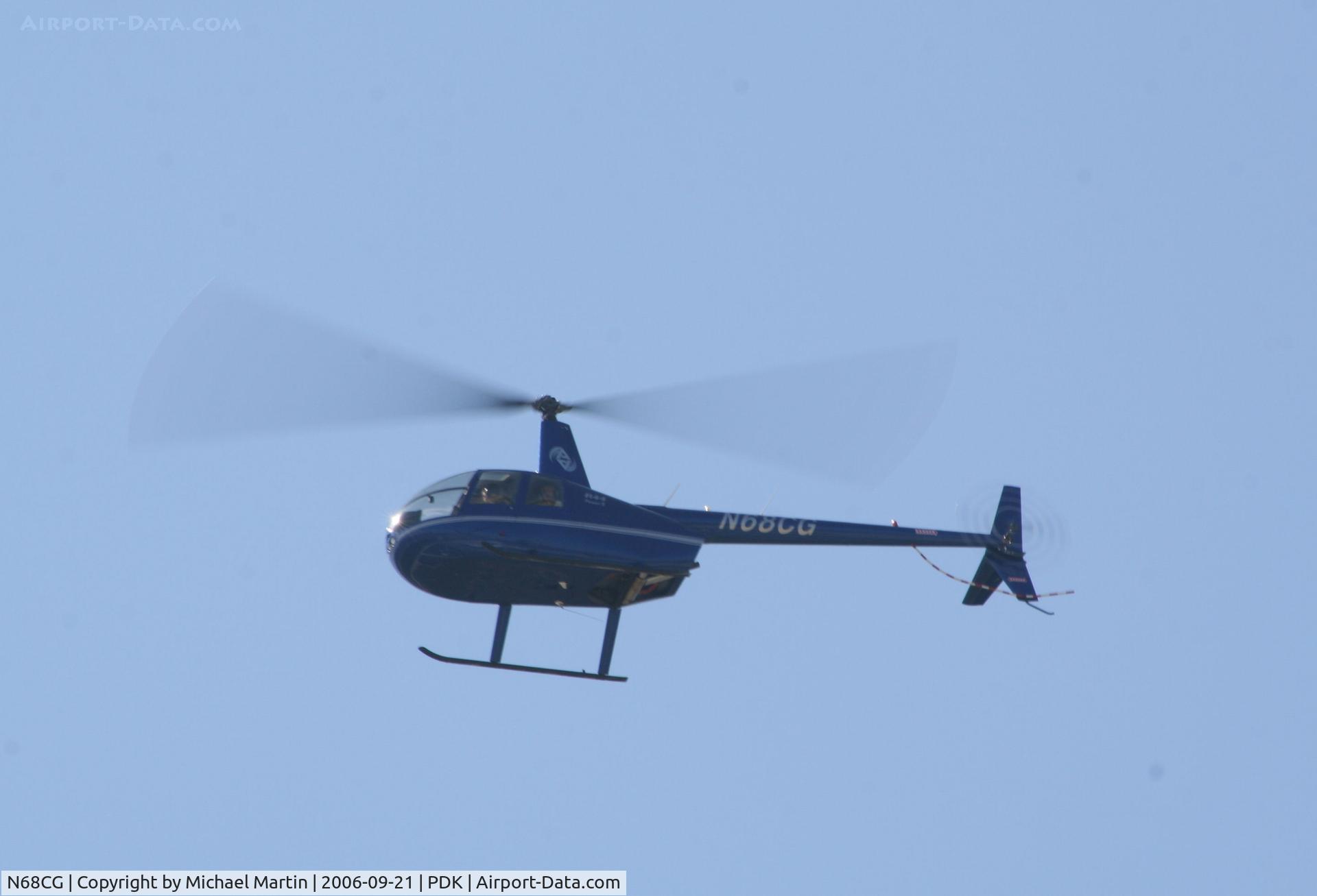N68CG, 2006 Robinson R44 II C/N 11312, Departing PDK