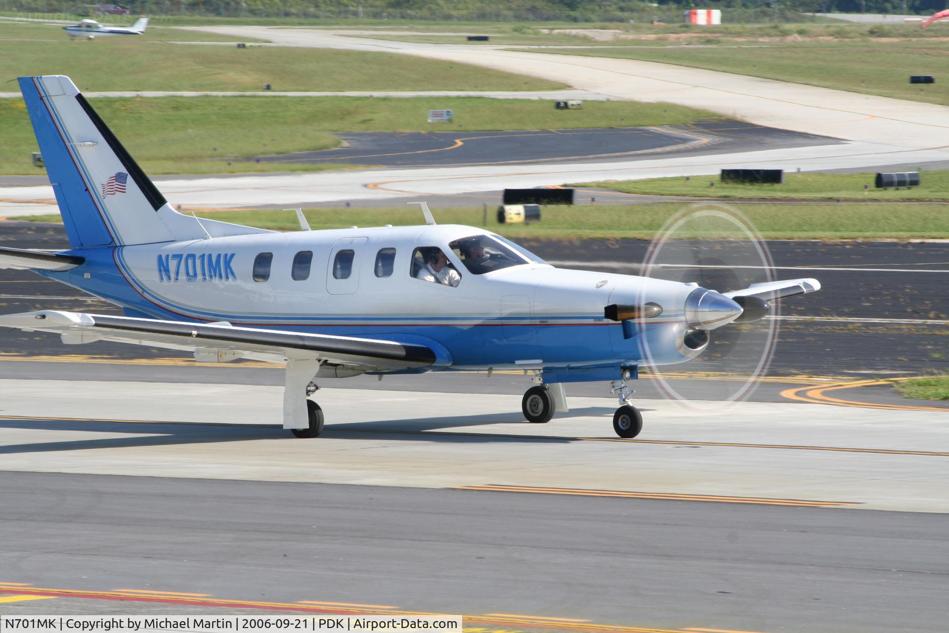 N701MK, 1997 Socata TBM-700 C/N 124, Taxing from Epps Air Service