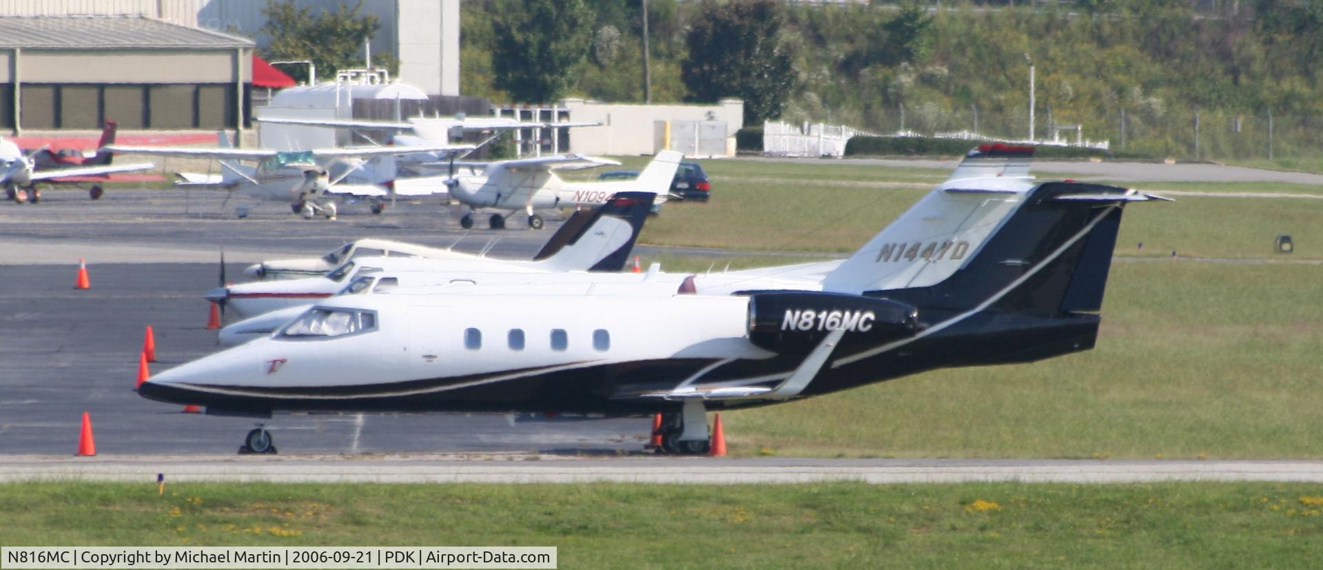 N816MC, 1982 Gates Learjet 55 C/N 035, Tied down @ Signature Flight Services (Long range photo - pardon image)