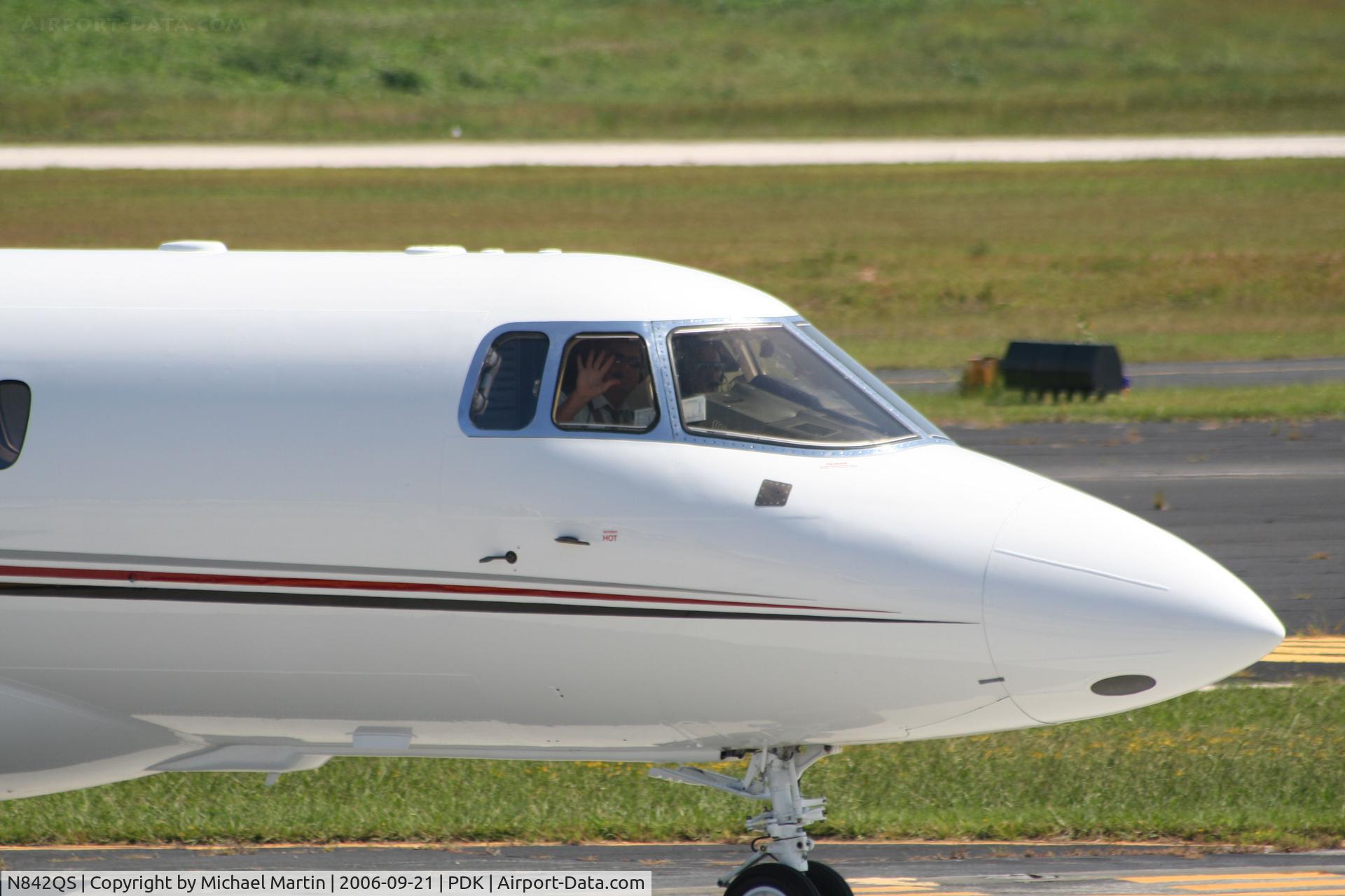 N842QS, 2001 Raytheon Hawker 800XP C/N 258542, Friendly Co-Pilot waving to me!
