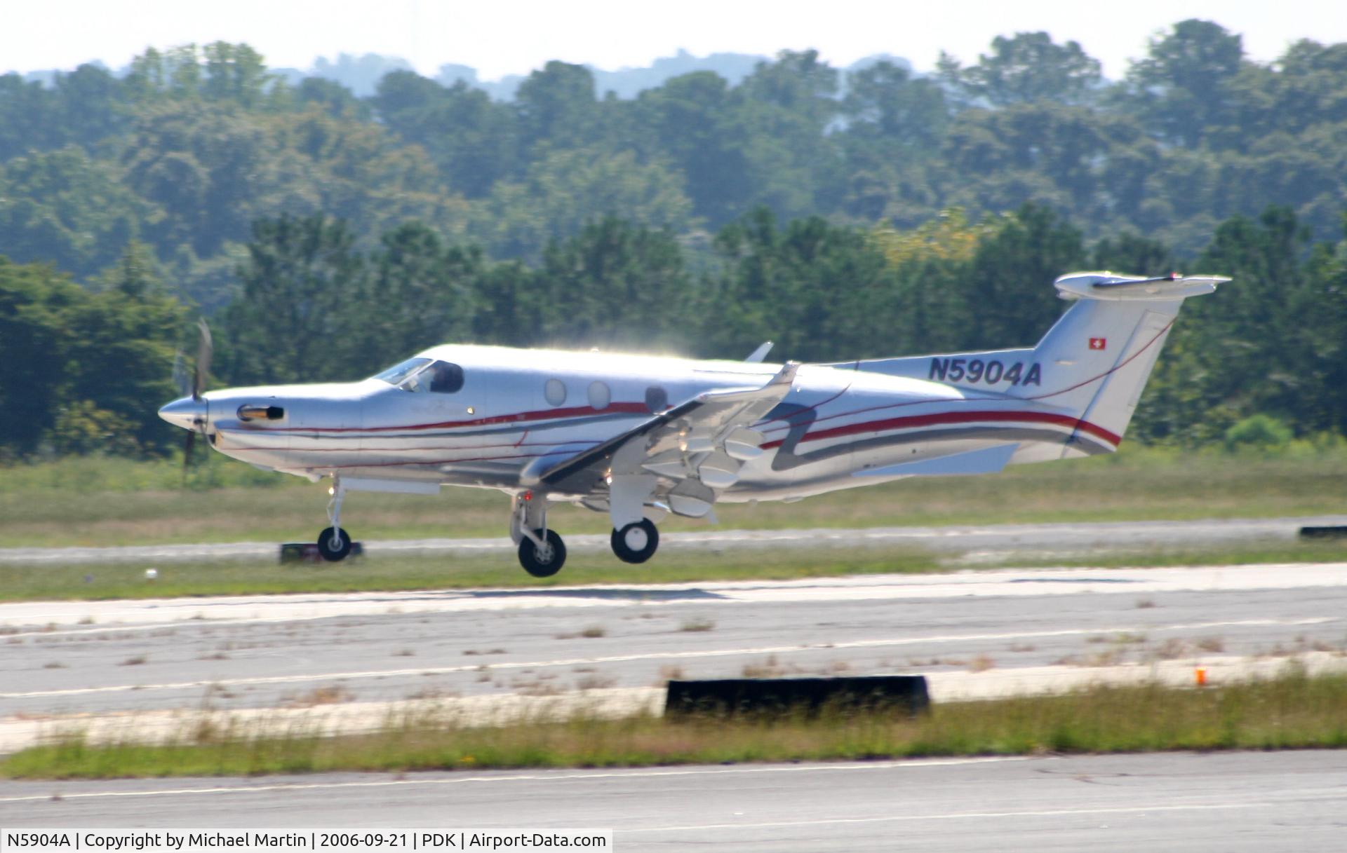 N5904A, 2004 Pilatus PC-12/45 C/N 583, Departing PDK enroute to TJIG
